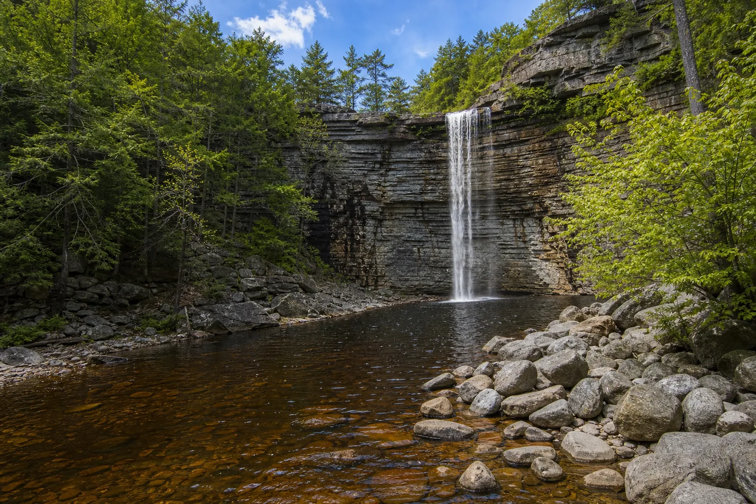 Awosting Falls wide view of the 60-foot awosting falls plunge over the shawangunk conglomerate cliff into the peters kill canyon.