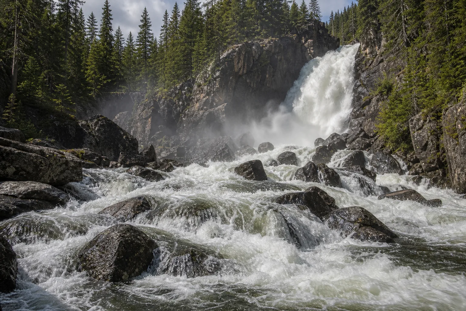 Fish Creek Falls spring runoff hitting the lower bowl after the gneiss bench split the column into two tiers