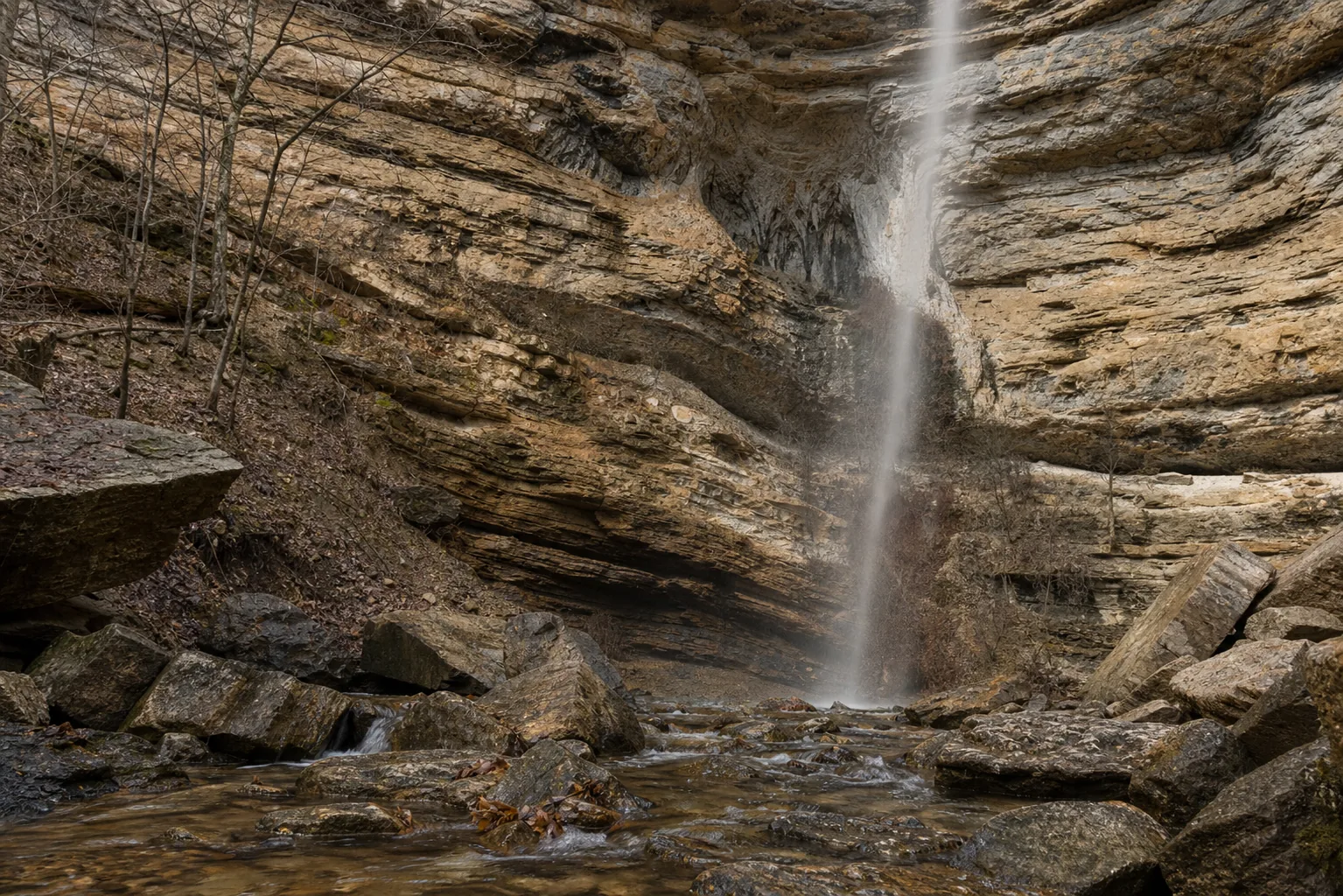 Hemmed-In-Hollow Falls water hitting the talus with wet Atoka sandstone bluff face behind