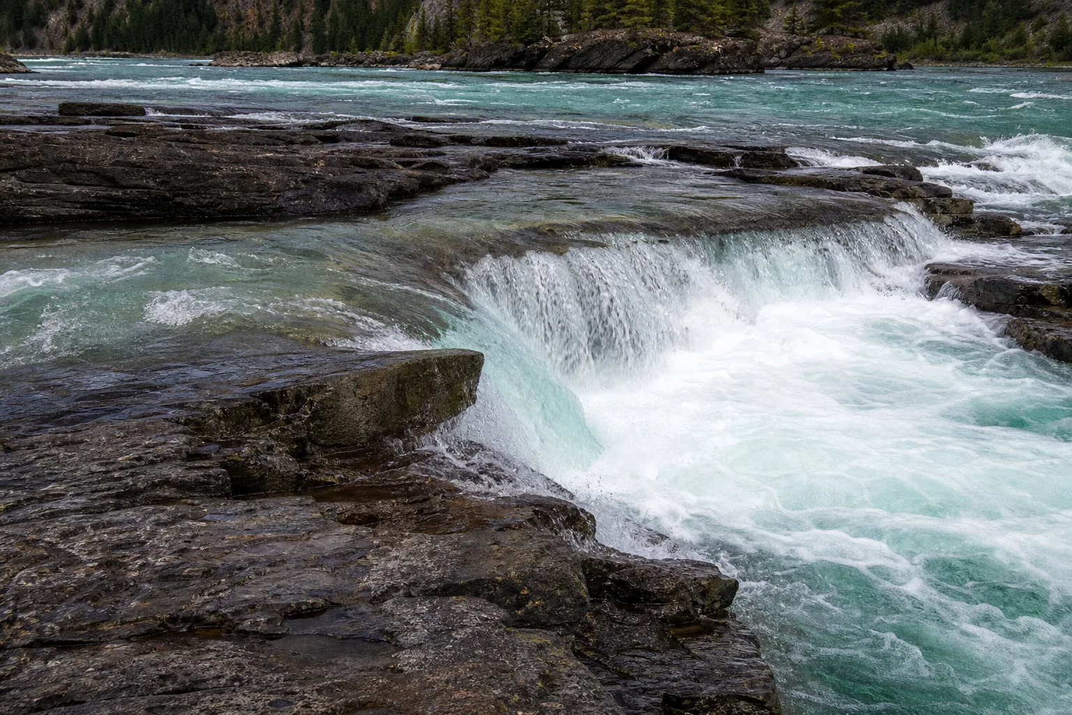 Kootenai Falls close detail of water sluicing across Belt Supergroup quartzite shelves