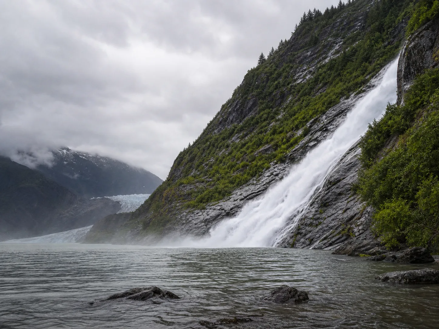 Nugget Falls the full 377-foot two-tier drop into mendenhall lake, with the glacier valley across the water