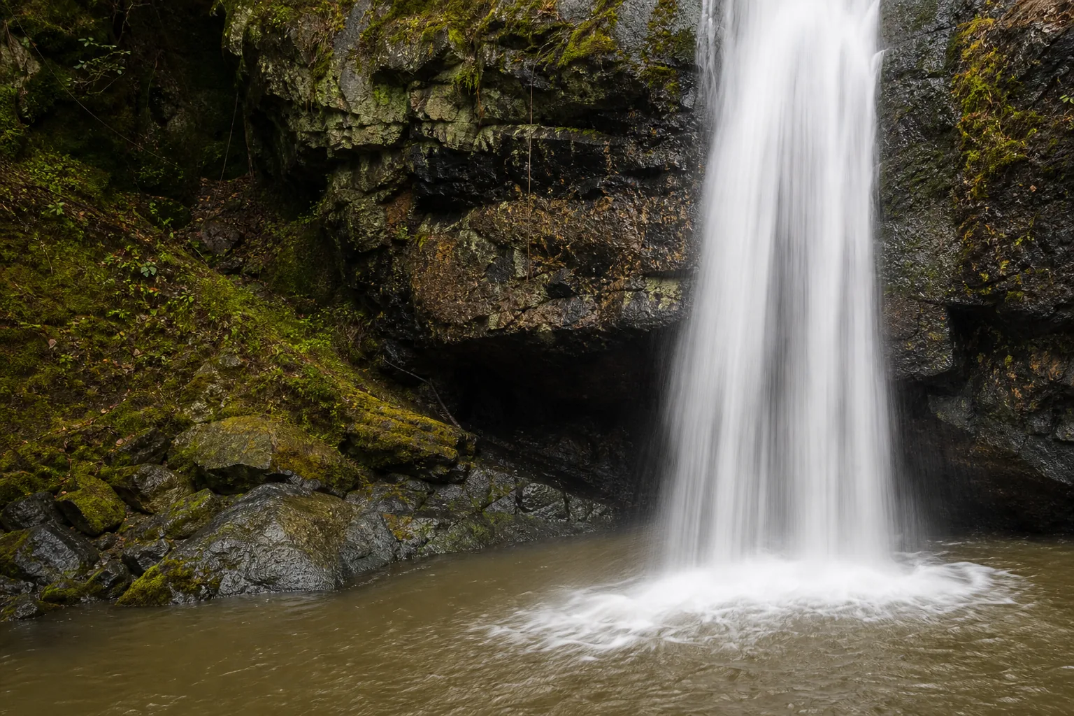 Close detail of Potem Falls water hitting basalt at the plunge pool