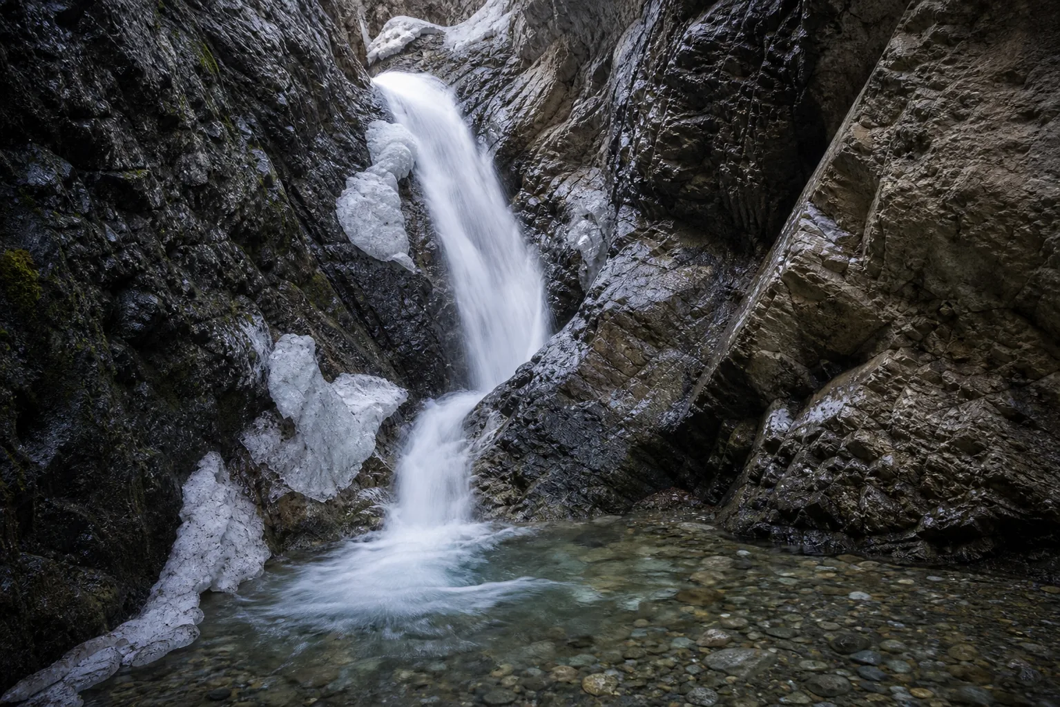Zapata Falls the 30-foot drop seen from inside the slot canyon after the wade up south zapata creek.